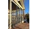 Enclosed porch featuring an expansive view and railing overlooking calm waters at 141 Sunrise Pt, New London, NC 28127