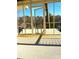 Inviting screened-in porch with a water view and a door to a private retreat at 141 Sunrise Pt, New London, NC 28127