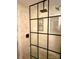 Modern tiled walk-in shower with black hardware and glass surround at 141 Sunrise Pt, New London, NC 28127