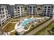 Aerial view of the condo complex showcasing the luxurious pool, cabanas, meticulously landscaped grounds, and inviting lounge areas at 19329 Watermark Dr # 142, Cornelius, NC 28031