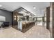 Modern bar area with marble countertops, stylish seating, and contemporary lighting fixtures at 19329 Watermark Dr # 142, Cornelius, NC 28031