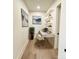 Cozy home office with modern desk and chair, floating shelves, and stylish decor at 19329 Watermark Dr # 142, Cornelius, NC 28031