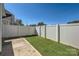 Backyard featuring well maintained artificial turf and white vinyl fence at 1111 Johns Walk Way, Belmont, NC 28012