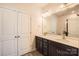 Bathroom features double sink vanity with quartz countertop and ample cabinet space at 1111 Johns Walk Way, Belmont, NC 28012