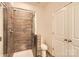 Modern bathroom with glass-enclosed shower and tiled walls at 1111 Johns Walk Way, Belmont, NC 28012