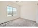 Bright bedroom featuring a large window with neighborhood view and carpeted floors at 1111 Johns Walk Way, Belmont, NC 28012