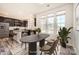 A staged dining room and kitchen with stainless steel appliances and a center island at 1111 Johns Walk Way, Belmont, NC 28012