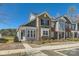 Attractive townhome with brick and siding, manicured landscaping, and sidewalk at 1111 Johns Walk Way, Belmont, NC 28012