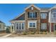 Attractive townhome featuring brick and siding, and sidewalk at 1111 Johns Walk Way, Belmont, NC 28012