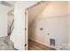 Laundry room features an access door and hanging wire shelves at 1111 Johns Walk Way, Belmont, NC 28012