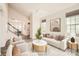 A bright and spacious staged living room with a staircase at 1111 Johns Walk Way, Belmont, NC 28012