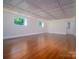 Unfinished basement with hardwood floors and recessed lighting at 317 Belwood Dr, Belmont, NC 28012