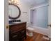 Bathroom with vintage vanity, sink and shower combo at 317 Belwood Dr, Belmont, NC 28012