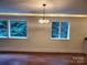 Bright dining room with hardwood floors, recessed lighting, and large windows at 317 Belwood Dr, Belmont, NC 28012