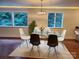 Bright dining room features a glass table, modern chairs, and great natural lighting at 317 Belwood Dr, Belmont, NC 28012