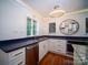Updated kitchen with modern appliances, granite countertops, custom cabinets, and a stylish lighting fixture at 317 Belwood Dr, Belmont, NC 28012