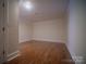 Neutral room with wood floors, trim work, neutral paint and natural light that would make a great living area at 317 Belwood Dr, Belmont, NC 28012