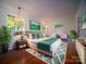 Bright and spacious main bedroom features a king bed, lamps, and ample natural light at 317 Belwood Dr, Belmont, NC 28012