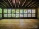 Outdoor porch with wooden floors, a vaulted ceiling, and open windows at 317 Belwood Dr, Belmont, NC 28012