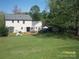 Expansive backyard with patio, seating, and lush lawn, ideal for outdoor gatherings at 443 Silversmith Ln # 16, Charlotte, NC 28270