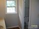 Toilet view in the bathroom boasting a bright window and crisp white trim at 443 Silversmith Ln # 16, Charlotte, NC 28270