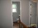 Upstairs bathroom featuring stylish vanity, toilet and view through a window at 443 Silversmith Ln # 16, Charlotte, NC 28270