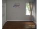 Bedroom showing wood floors, natural light, and ample closet space at 443 Silversmith Ln # 16, Charlotte, NC 28270