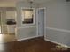 Dining area with hardwood floors that opens into a kitchen area at 443 Silversmith Ln # 16, Charlotte, NC 28270