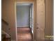 Entry hall featuring vinyl floors and a staircase to the second floor at 443 Silversmith Ln # 16, Charlotte, NC 28270