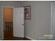 Hallway with an open door and an decorative painting on the wall at 443 Silversmith Ln # 16, Charlotte, NC 28270