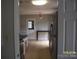 Bright eat-in kitchen area with stainless steel refrigerator and access to back door at 443 Silversmith Ln # 16, Charlotte, NC 28270