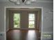 Bright living room filled with natural light boasts vinyl floors at 443 Silversmith Ln # 16, Charlotte, NC 28270