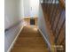 Staircase with beautiful wooden steps leading down to main level at 443 Silversmith Ln # 16, Charlotte, NC 28270