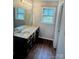 Bathroom featuring a large vanity with a sink, and a big mirror at 443 Silversmith Ln, Charlotte, NC 28270