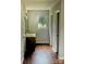 Bathroom with wood-look floors, single sink vanity, and plenty of space at 443 Silversmith Ln, Charlotte, NC 28270