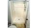 Bathroom featuring a shower, a toilet, and a new door at 443 Silversmith Ln, Charlotte, NC 28270