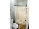Bathroom featuring a shower, a toilet, and a new door at 443 Silversmith Ln, Charlotte, NC 28270