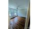Spacious bedroom featuring beautiful wood-look flooring and a modern ceiling fan at 443 Silversmith Ln, Charlotte, NC 28270
