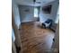 Comfortable bedroom with hardwood floors, natural light, ceiling fan, and closet space at 443 Silversmith Ln, Charlotte, NC 28270