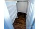 Walk-in closet with wood-look floors, rod and a lot of shelves at 443 Silversmith Ln, Charlotte, NC 28270