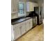Bright kitchen with stainless steel appliances, double sink, and white cabinets at 443 Silversmith Ln, Charlotte, NC 28270