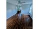 Bedroom with wood-look flooring and an ensuite bathroom at 443 Silversmith Ln, Charlotte, NC 28270