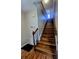 Elegant staircase with wood steps, handrail, and banister leading to the upper level of the home at 443 Silversmith Ln, Charlotte, NC 28270