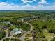 Aerial view featuring community amenities, including a pool, tennis courts, and walking trails at 7605 Berryfield Ct, Waxhaw, NC 28173