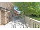 Enjoy outdoor living on this white deck with seating and a view of the backyard at 7605 Berryfield Ct, Waxhaw, NC 28173