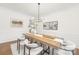 Chic dining room with modern chandelier, hardwood floors, and stylish decor, perfect for entertaining guests at 7605 Berryfield Ct, Waxhaw, NC 28173