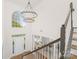 Bright foyer with high ceilings, hardwood floors, and grand staircase, showcasing an open and inviting entrance at 7605 Berryfield Ct, Waxhaw, NC 28173
