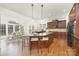 Spacious kitchen with island, bar seating, and adjacent dining area at 7605 Berryfield Ct, Waxhaw, NC 28173