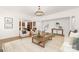 Open-concept living room with hardwood floors, light-filled space, and stylish decor at 7605 Berryfield Ct, Waxhaw, NC 28173