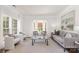 Cozy living room with bay window, neutral tones, and comfortable seating, ideal for intimate gatherings at 7605 Berryfield Ct, Waxhaw, NC 28173